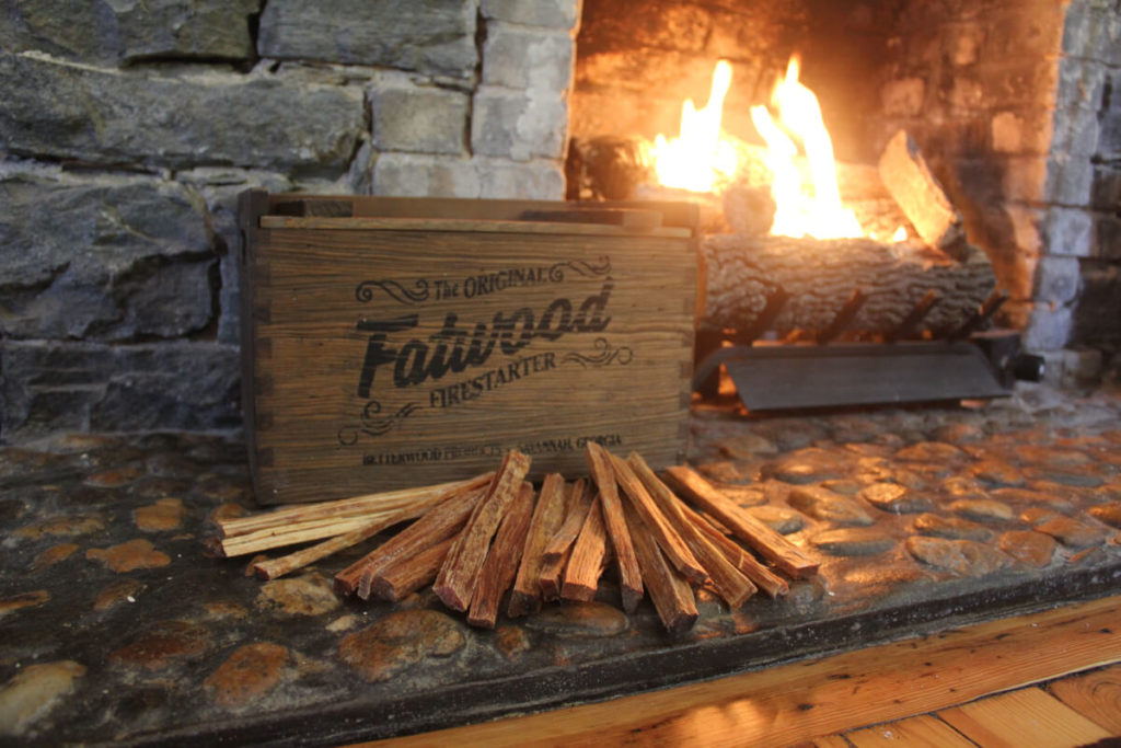fatwood in wooden box  by fireplace